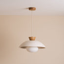 White ceramic pendant light hanging from oak ceiling rose against a cream wall