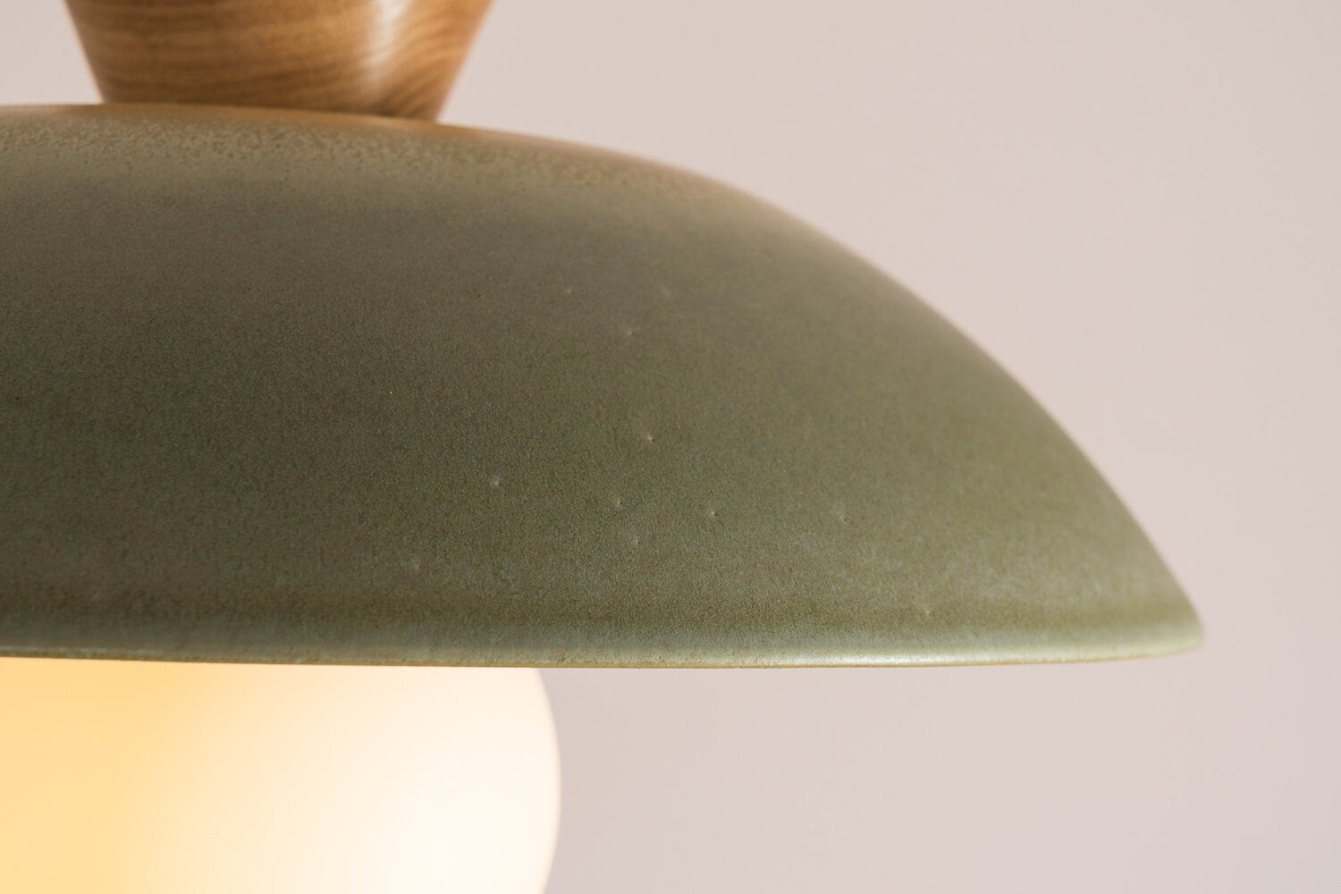 Dawn pendant light in a matt green glaze by StudioHaran