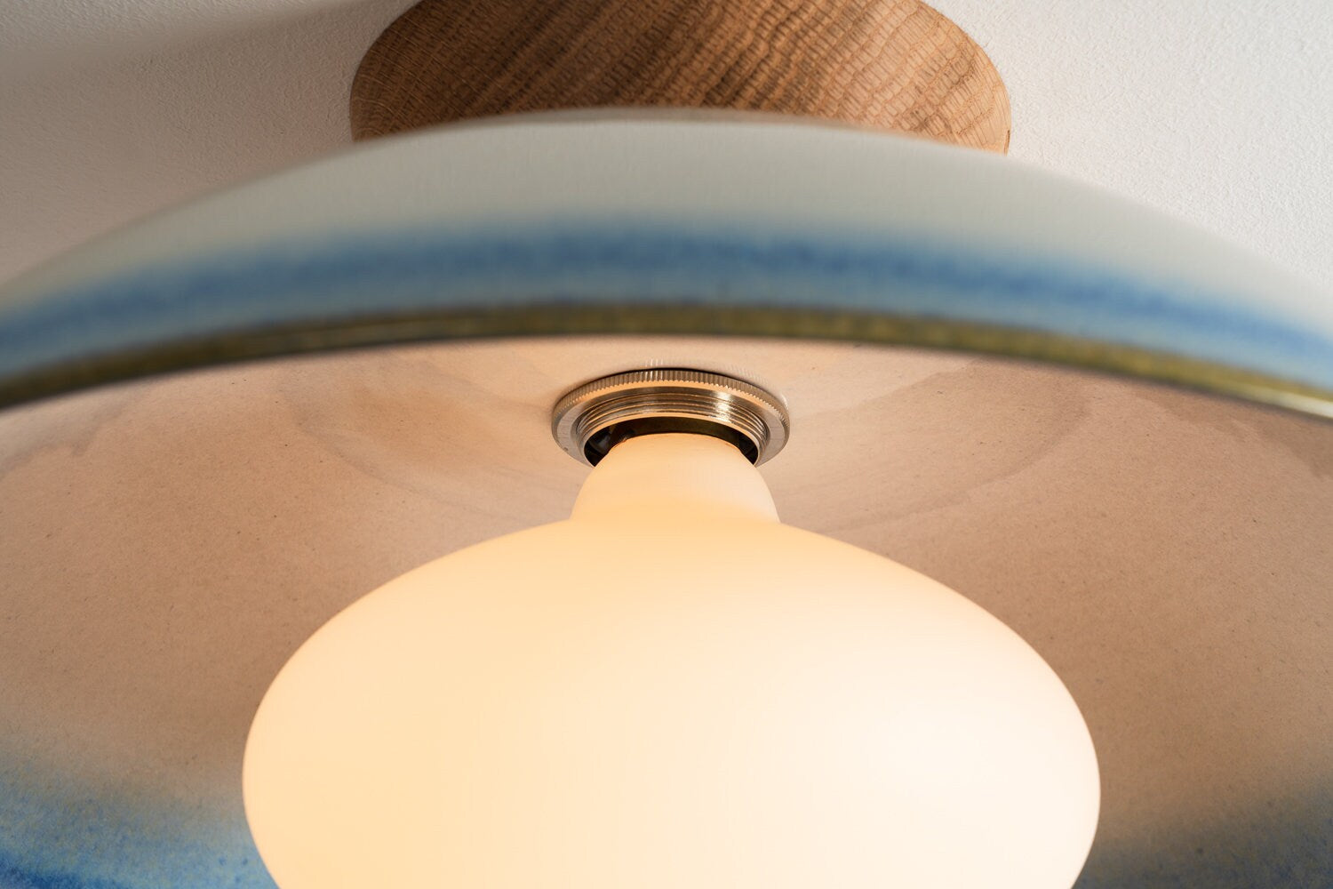 Dawn flush ceiling light in ceramic and oak with a blue and white gloss glaze by StudioHaran