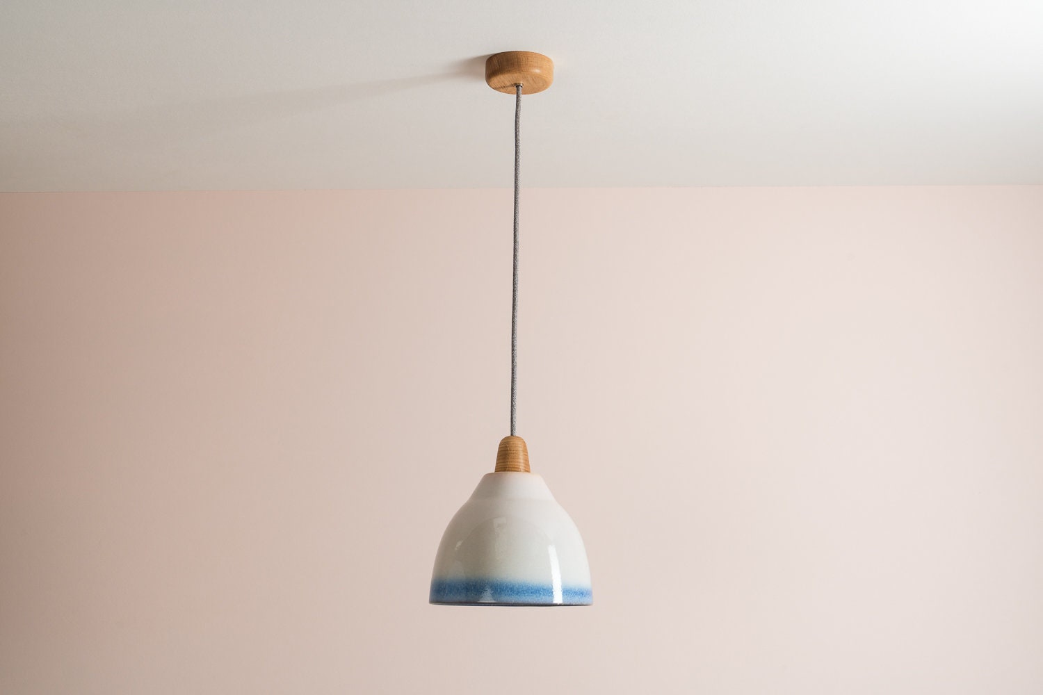 Element pendant with a blue and white gloss glaze by StudioHaran