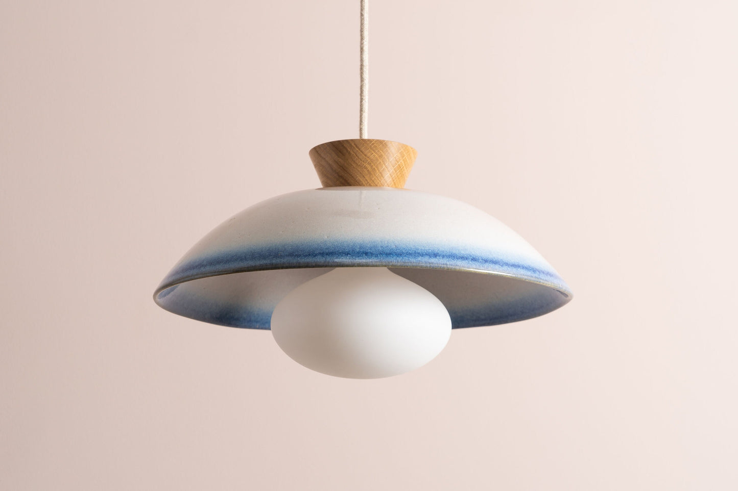 Dawn pendant light in a blue and white gloss glaze by StudioHaran