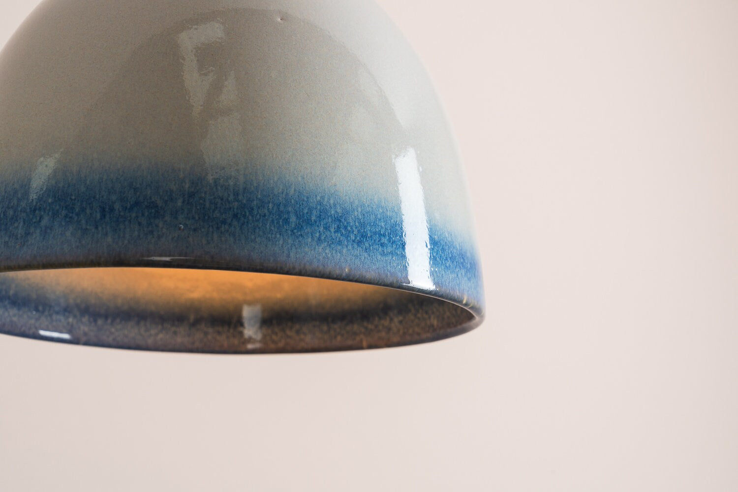 Element flush mount ceiling light in ceramic and oak with a blue and white gloss glaze by StudioHaran